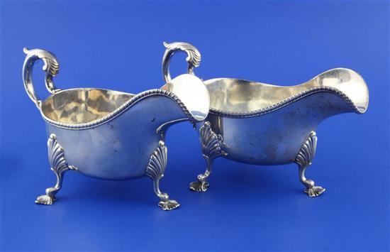 A pair of late Victorian silver sauceboats by Wakely & Wheeler, 22 oz.